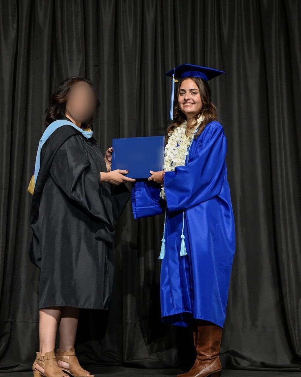 Now: Penny receiving her diploma on stage.